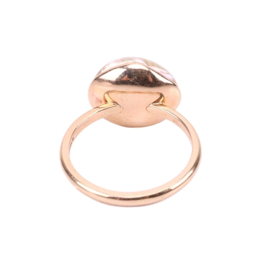 85 - A blister pearl dress ring in 9ct gold, set with an irregularly shaped Baroque blister pearl, with p... 