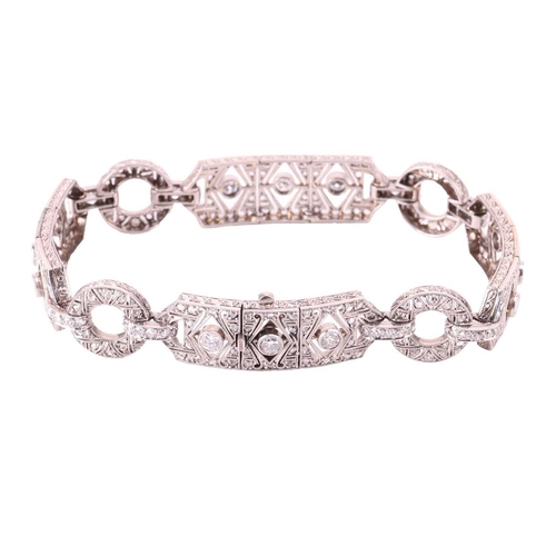 97 - An Art Deco diamond bracelet, set throughout with old cut, single cut and rose cut diamonds, with a ... 