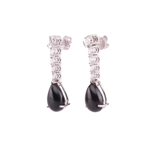 99 - A pair of jet and diamond-set drop earrings, claw-set with five graduated round brilliant diamonds, ... 