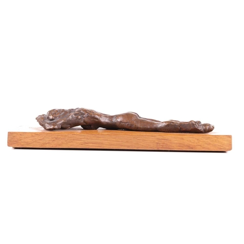 29 - † John Doubleday (b.1947), a patinated bronze study of a recumbent female nude, lying face down, on ... 