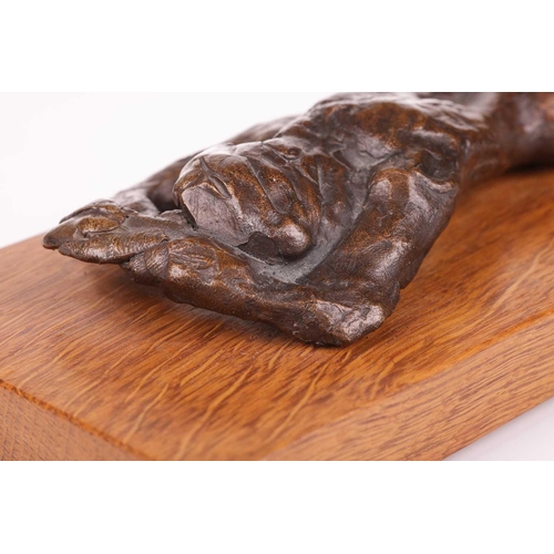 29 - † John Doubleday (b.1947), a patinated bronze study of a recumbent female nude, lying face down, on ... 