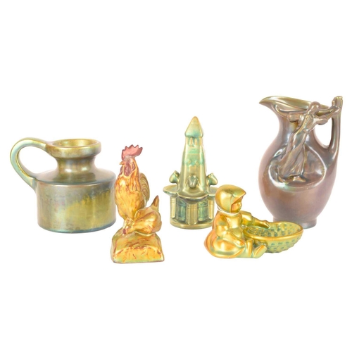 56 - A collection of five small Zsolnay ceramic lustre items, consisting of a figural jug, 17cm high, a Z... 