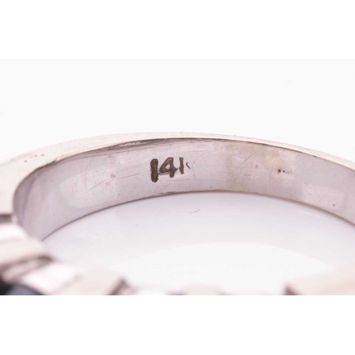 125 - A seven-stone diamond half hoop ring, the alternating baguette-cut white diamonds and treated round ... 