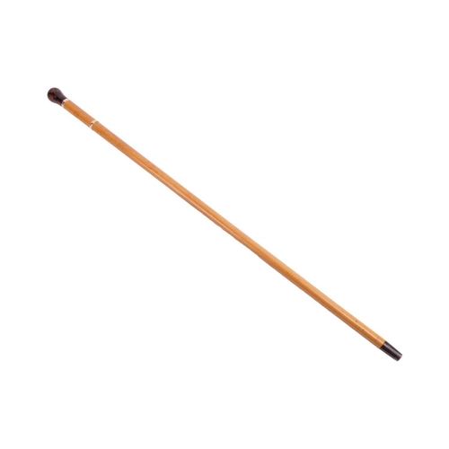 183 - A Malacca walking cane with resin pommel, the connecting gold band with hallmarks for 12ct gold and ... 
