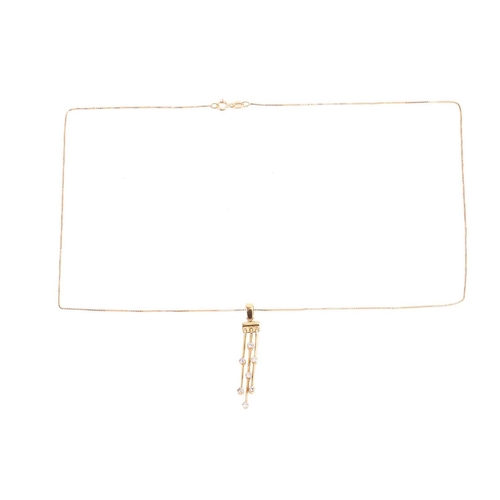 58 - A diamond-set tassel necklace in 18ct yellow gold, suspended with three articulated bars, interspers... 