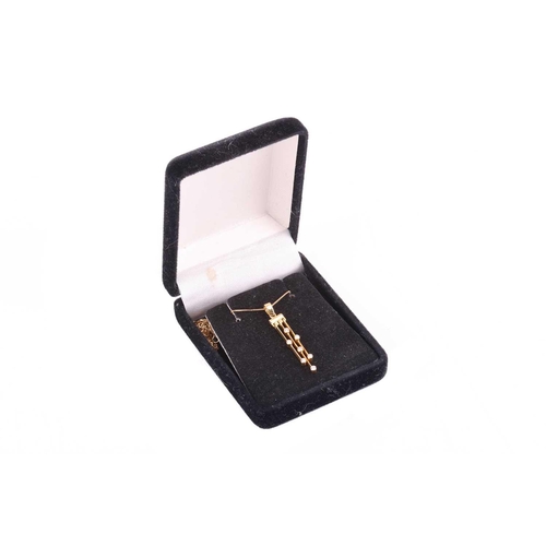 58 - A diamond-set tassel necklace in 18ct yellow gold, suspended with three articulated bars, interspers... 