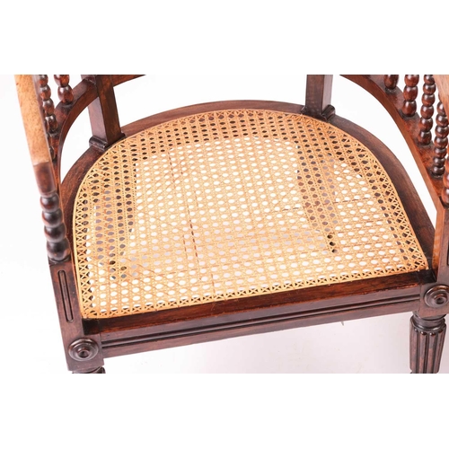 215 - A late regency, possibly colonial Indian rosewood hoop-backed armchair and 