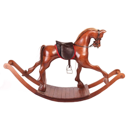 217 - A large polished mahogany rocking horse, 20th century with leather tack and horsehair tail and main,... 