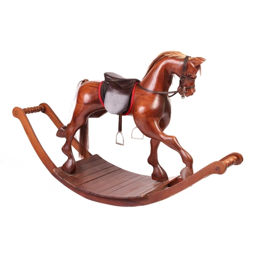 217 - A large polished mahogany rocking horse, 20th century with leather tack and horsehair tail and main,... 