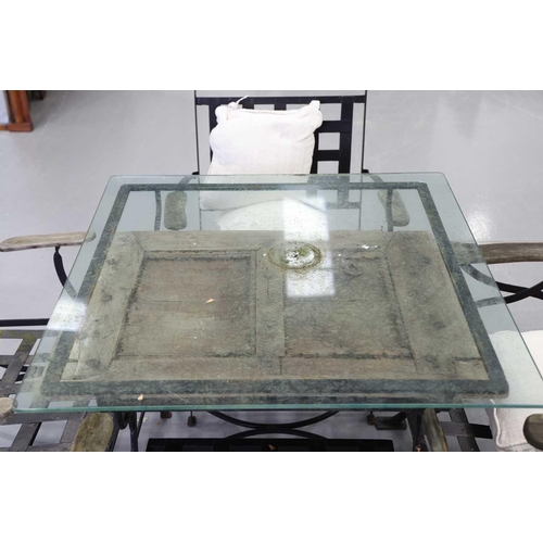 223 - A square blacksmith-made, black wrought iron garden table, 20th century, with heavy plate glass top ... 