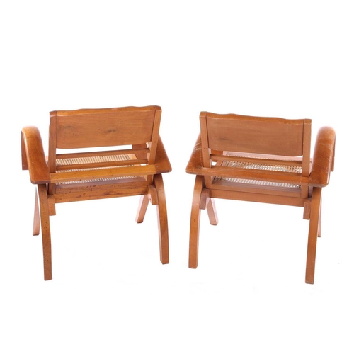 227 - A pair of French Art Deco figured maple open armchairs with folding moulded backs and, the seats wit... 