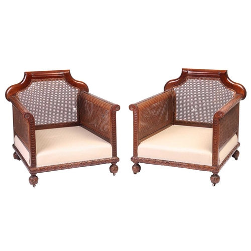 228 - A pair of Edwardian mahogany Bergere club armchairs, probably by Jas Shoolbred of London (unmarked),... 