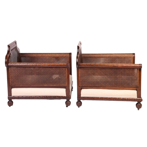 228 - A pair of Edwardian mahogany Bergere club armchairs, probably by Jas Shoolbred of London (unmarked),... 