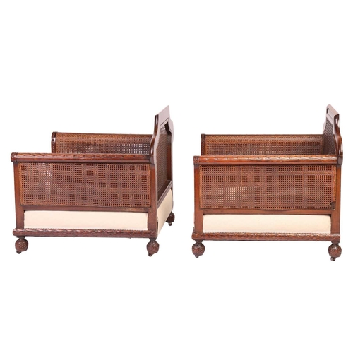 228 - A pair of Edwardian mahogany Bergere club armchairs, probably by Jas Shoolbred of London (unmarked),... 