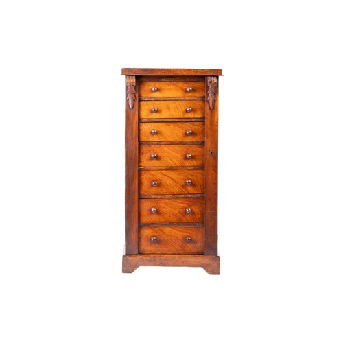 238 - A Victorian walnut pedestal Wellington chest of seven drawers with a single register bar and simple ... 