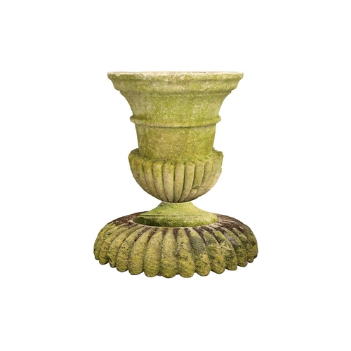 247 - A carved and established limestone campana urn constructed in sections, with a heavy gadrooned colla... 