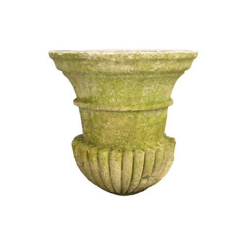 247 - A carved and established limestone campana urn constructed in sections, with a heavy gadrooned colla... 