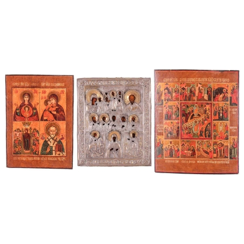 252 - A late 19th-century Russian icon depicting Saints, with silvered-metal oklad, 31 cm x 26 cm, togethe... 