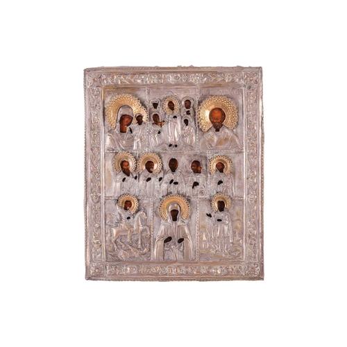 252 - A late 19th-century Russian icon depicting Saints, with silvered-metal oklad, 31 cm x 26 cm, togethe... 