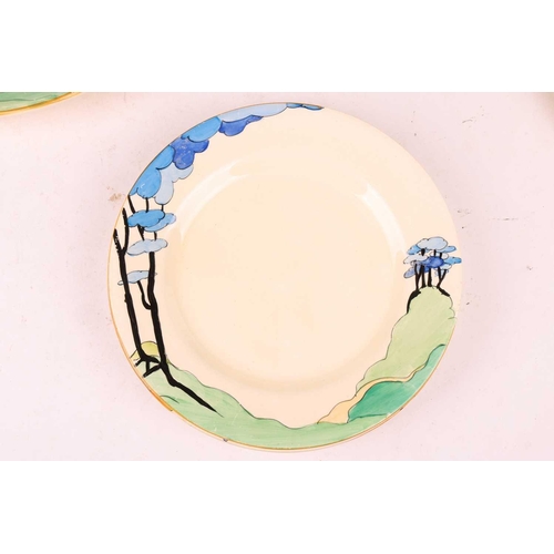 254 - A Clarice Cliff Bizarre 'Blue Firs' part dinner service, comprising a pair of covered tureens (20 cm... 