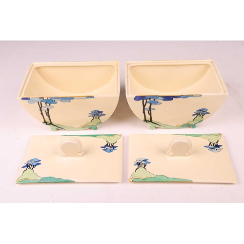 254 - A Clarice Cliff Bizarre 'Blue Firs' part dinner service, comprising a pair of covered tureens (20 cm... 