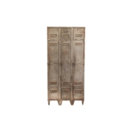 268 - A vintage industrial brushed steel three-door gym locker, with vented doors and squat angular feet. ... 