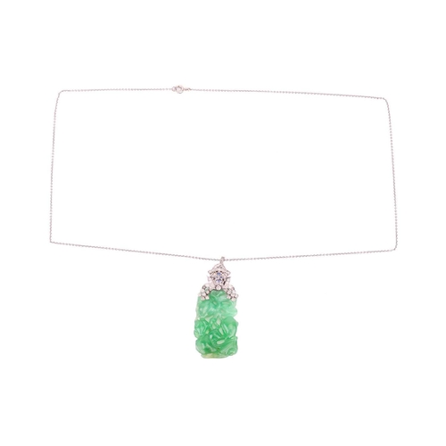 41 - An Art Deco carved jade pendant with diamond-set surmount on chain, the rectangular bright green jad... 