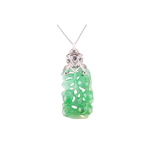 41 - An Art Deco carved jade pendant with diamond-set surmount on chain, the rectangular bright green jad... 