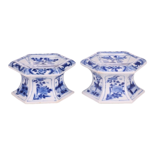 102 - A pair of Chinese blue and white porcelain hexagonal table salts of waisted panelled form, late Qing... 