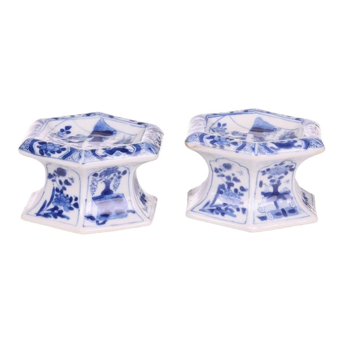 102 - A pair of Chinese blue and white porcelain hexagonal table salts of waisted panelled form, late Qing... 