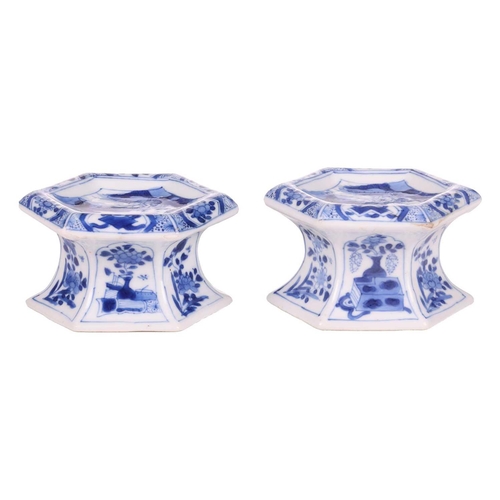 102 - A pair of Chinese blue and white porcelain hexagonal table salts of waisted panelled form, late Qing... 