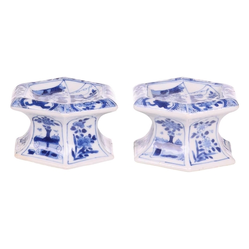 102 - A pair of Chinese blue and white porcelain hexagonal table salts of waisted panelled form, late Qing... 