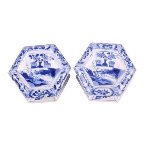 102 - A pair of Chinese blue and white porcelain hexagonal table salts of waisted panelled form, late Qing... 