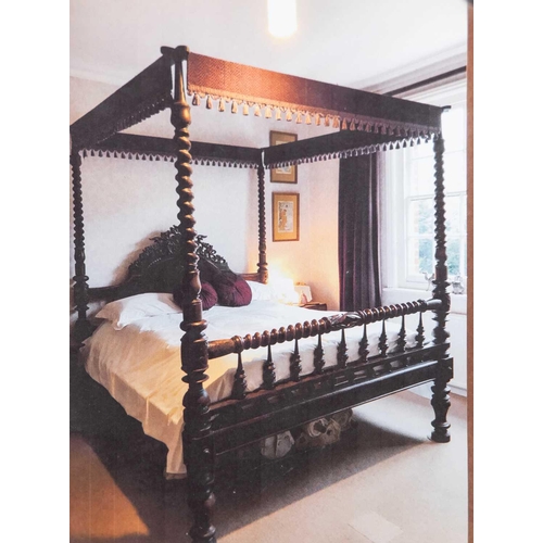 109 - A massive probably Ceylonese Four Poster Bed retailed by Liberty of London, with carved and pierced ... 