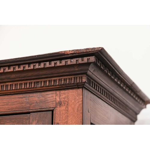 117 - A Welsh (Camarthen) oak coffer/cupboard, late 18th century, with a pair of distinctive lancet panel ... 