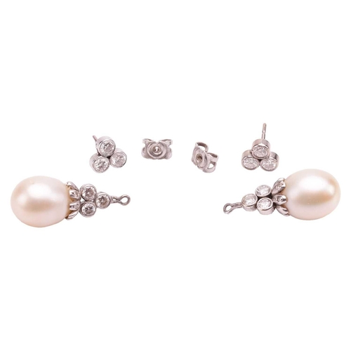 1 - A pair of diamond and pearl day and night earrings, surmounts of trefoil form suspending detachable ... 