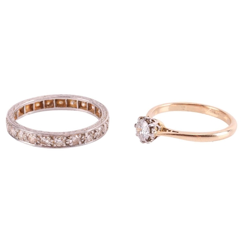 100 - A diamond solitaire ring and an eternity ring; the solitaire ring consists of a transitional cut dia... 