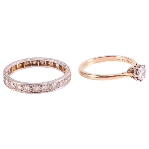 100 - A diamond solitaire ring and an eternity ring; the solitaire ring consists of a transitional cut dia... 