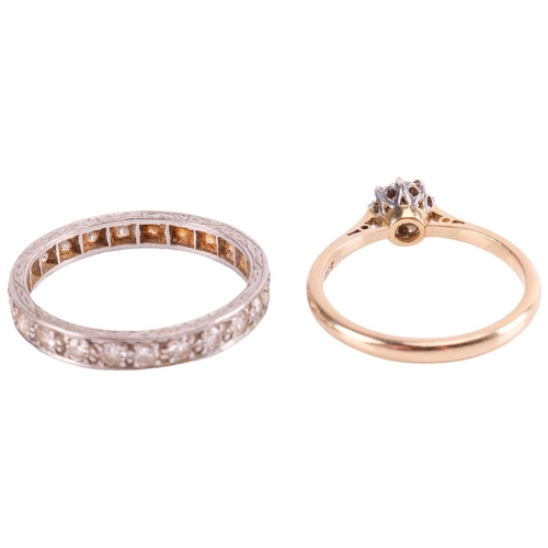 100 - A diamond solitaire ring and an eternity ring; the solitaire ring consists of a transitional cut dia... 