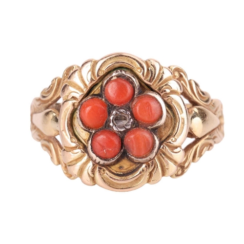 108 - A mid 19th-Century coral and diamond floral ring, the central lozenge-shaped panel set with a daisy ... 