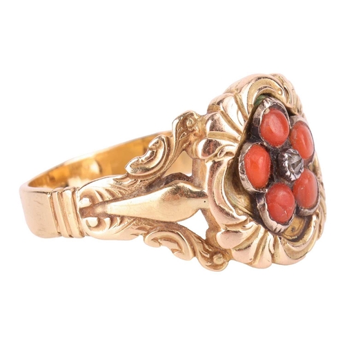 108 - A mid 19th-Century coral and diamond floral ring, the central lozenge-shaped panel set with a daisy ... 