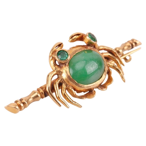 111 - A jade crab bar brooch, centred with a crab motif with an oval jadeite cabochon and green paste as e... 