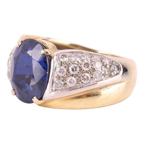 120 - A gem-set dress ring, centred with an oval-cut synthetic sapphire of 11.9 x 9.8 x 6.8 mm, claw-set b... 