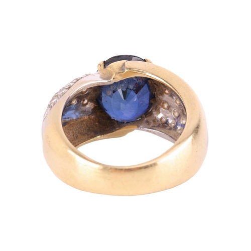 120 - A gem-set dress ring, centred with an oval-cut synthetic sapphire of 11.9 x 9.8 x 6.8 mm, claw-set b... 