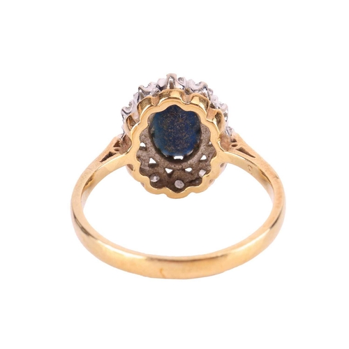 122 - A sapphire and diamond cluster ring in 18ct gold, comprising an oval-cut sapphire of dark blue colou... 