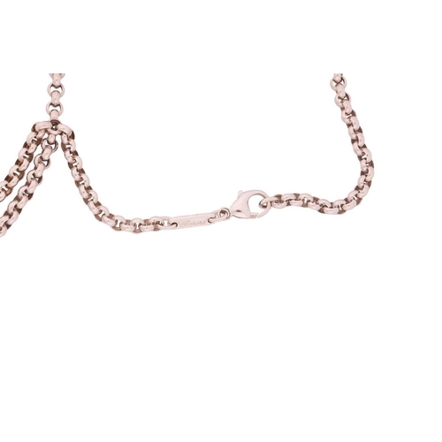 16 - Chopard - a 'Happy Diamonds' heart pendant on chain, heart-shaped glazed motif enclosing five floati... 