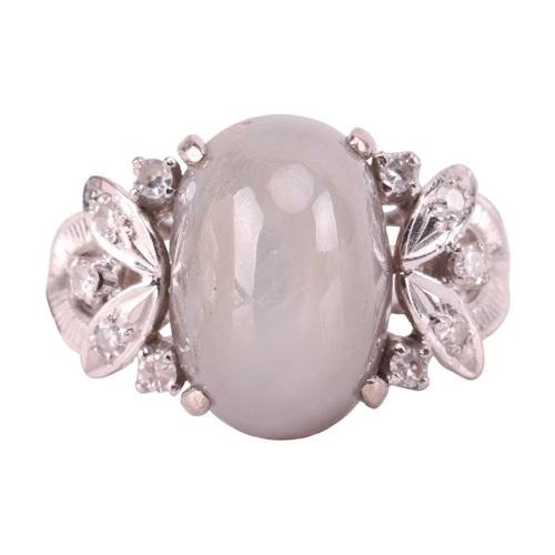 28 - A grey star sapphire and diamond dress ring, featuring an oval cabochon of a light grey sapphire cab... 