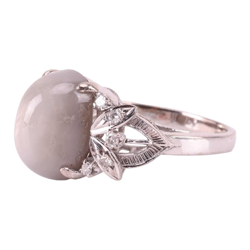 28 - A grey star sapphire and diamond dress ring, featuring an oval cabochon of a light grey sapphire cab... 