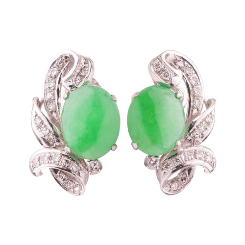 33 - A pair of jade and diamond earrings, each contains an oval jadeite cabochon of bright green colour, ... 