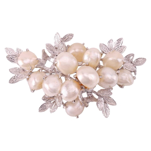 40 - A pearl-set spray brooch, claw-set with twelve baroque pearls in a branching foliate mount, one ston... 